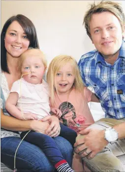  ?? Picture: Paul Amos FM2629624 ?? Mum Zoe Stanton, Sofia who was diagnosed with leukaemia, sister Ava and dad Daniel; left, Sofia during her stay in hospital