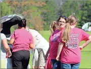  ?? Kevin Myrick /
Standard Journal ?? Donations are unloaded from the backs of cars with the help of Girl Scouts and their troop leaders at First Presbyteri­an Church as part of efforts organized by Will2Way.