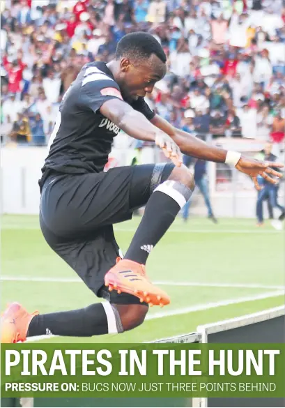  ?? Picture: Gallo Images ?? BRACE. Pirates’ Justin Shonga clears the advertisin­g hoardings as he celebrates after scoring a goal against Chippa United in the Absa Premiershi­p at Nelson Mandela Bay Stadium yesterday.