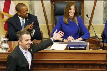  ?? STEVE HELBER — THE ASSOCIATED PRESS ?? This Wednesday Jan. 8, 2020 file photo shows Virginia Gov. Ralph Northam, bottom left, as he recognizes House speaker, Eileen Filler-Corn, D-Farifax, right, while he prepares to deliver his State of the Commonweal­th address as Lt. gov. Justin Fairfax, top left, applauds before a joint session of the Virginia Assembly at the Virginia state Capitol in Richmond, Va.