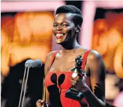  ??  ?? Winning smile: Sheila Atim receiving her Olivier award for best supporting actress in April, left; and pictured at the Sackler Studios, in London, earlier this month, right