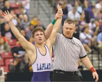  ?? FILE PHOTO BY ANDY STATES ?? La Plata’s Cameron Butler has his hand raised after defeating Kyle Farace of Oakland Mills by a 4-0 decision in the Class 2A-1A 120-pound state final on March 5 at The Show Place Arena in Upper Marlboro.