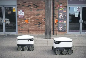  ?? ?? Autonomous Starship robots deliver groceries in Milton Keynes, England, on Sept 20.