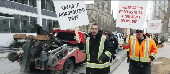  ?? TONY CALDWELL ?? A few dozen towtruck drivers protested at city hall on Monday, alleging police are steering potential business away from them.