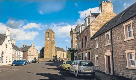  ?? Pictures: Steve MacDougall. ?? The village square near St Serfs Church, Dunning. There are worries areas like the Perthshire village are becoming unaffordab­le for younger buyers.