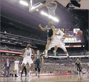  ?? DAVID J. PHILLIP / ASSOCIATED PRESS ?? Duke senior guard Quinn Cook, right, is fouled by Michigan State’s Marvin Clark Jr. while driving to the basket during the second half of the Blue Devils’ 81-61 victory Saturday in the national semifinals in Indianapol­is.