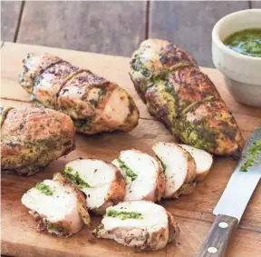  ?? KITCHEN VIA AP AMERICA’S TEST ?? This recipe for grilled pesto chicken is from America’s Test Kitchen.