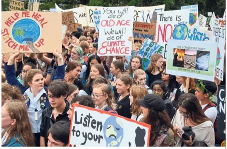  ??  ?? Making their voices heard: Students at the global school strike for action on climate change outside New Zealand’s parliament in Wellington. — Reuters