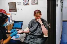  ?? Gabrielle Lurie/Staff file photo ?? After traveling three hours from Grandview, Courtney, 20, gets a medication abortion at a clinic in 2021 in Oklahoma City.