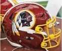  ?? ASSOCIATED PRESS FILE PHOTO ?? A Washington Redskins helmet sits on the sideline before a Dec. 15 game between the Cowboys and the Redskins in Arlington, Texas.