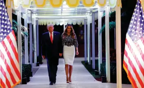  ?? (Reuters) ?? Donald Trump arrives with his wife Melania at an event to announce his candidacy