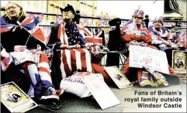  ??  ?? Fans of Britain’s royal family outside Windsor Castle