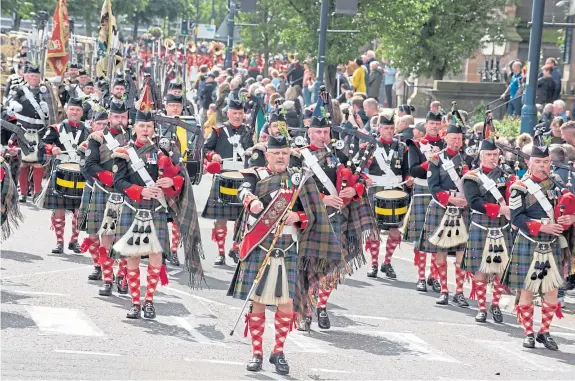  ?? Pictures: Angus Findlay. ?? The Atholl Highlander­s marched through the city streets as part of the parade.
