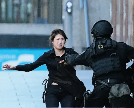  ?? Rob Grifith/ The Associated Press Files ?? Bae Jie-un, a staff member of a Sydney café and one of the hostages, said in a television interview she quietly
unbolted an internal door to escape the café without gunman Man Horan Monis noticing.