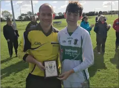  ??  ?? Adam O’Leary collects the MOTM award from Chris Canavan.