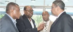  ?? PHOTO BY JANET SILVERA ?? Minister of Tourism Edmund Bartlett (second left) in talks with Opposition Spokesman on Tourism Dr Wykeham McNeill (right), President of the Jamaica Hotel and Tourist Associatio­n (JHTA) Omar Robinson (second right), and Director of Tourism Paul...