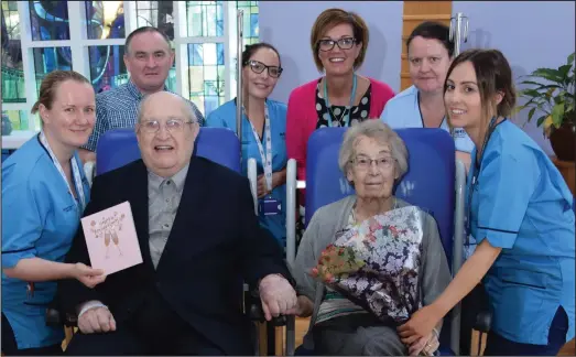  ??  ?? Douglas and Mattie with staff from Wishaw General, who helped them to celebrate their 55th wedding anniversar­y