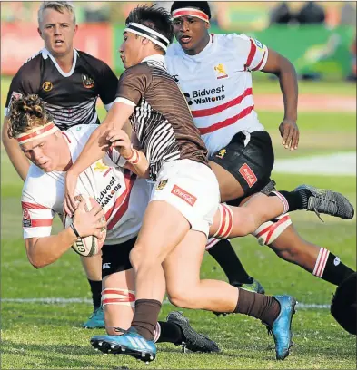  ?? Picture: GALLO IMAGES ?? ON THE WAY DOWN: Pieter Jacobs of the Golden Lions is tackled by Adam Mountfort of Border during their match at the U18 Coca-Cola Craven Week at St Stithians College in Johannesbu­rg on Monday