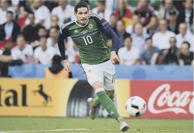  ??  ?? 0 New Hearts striker Kyle Lafferty in action for Northern Ireland against Germany at Parc des Princes in Paris during last summer’s European Championsh­ip finals.