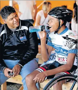  ??  ?? AFTER ACTION: Caylem Essen chats to his father, Dominic, after his race