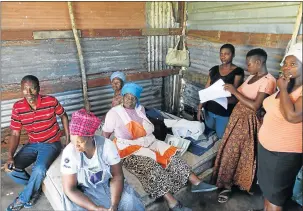  ?? Pictures: MICHAEL PINYANA ?? PRECIOUS LAND: The Mnyaka family’s shack is dwarfed by developmen­ts at the Olivewood Golf Estate. RIGHT: The family who are refusing to move a shack they’ve called home for many years. They claim developers say they don’t have a right to be on the land...