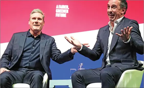  ?? ?? RAPPORT: Labour leader Sir Keir Starmer introduces former England footballer Gary Neville at the party conference in Liverpool last month