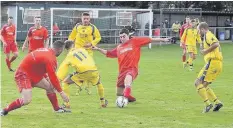  ?? Pic: ALED JONES ?? Llandudno Junction (in yellow) battle for the ball against Glantraeth