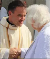  ??  ?? Fr Sean Jones being congratula­ted on his Ordination in Moyvane at the weekend.