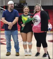  ?? (NWA Democrat-Gazette/Annette Beard) ?? Pea Ridge senior volleyball player Nalea Holliday was escorted Oct. 14 by her parents, Nash and Candice Holliday, during the team’s final home game.
