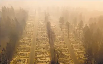  ?? Josh Edelson / AFP / Getty Images ?? A Nov. 15 aerial photo shows a neighborho­od in Paradise (Butte County) that was destroyed by the Camp Fire, which started Nov. 8.