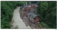  ?? AP ?? Rescuers search for victims Saturday after Typhoon Lekima caused a landslide in Yongjia County in China’s Zhejiang province.