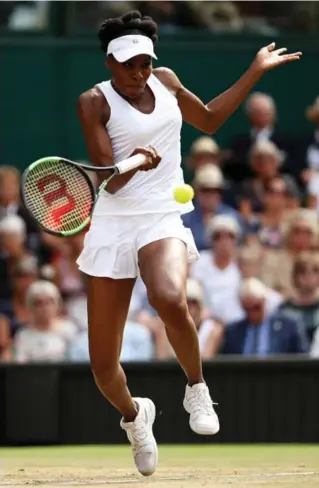  ?? JULIAN FINNEY/GETTY IMAGES ?? Venus Williams was never threatened in her 22nd Grand Slam semi, 20 years after her Wimbledon debut.