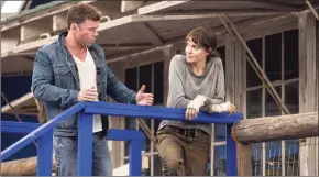  ?? Emerson Miller / AP ?? Director Taylor Sheridan, left, with Angelina Jolie on the set of "Those Who Wish Me Dead."