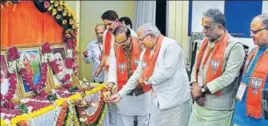  ?? HT PHOTO ?? Haryana CM Manohar Lal Khattar with Haryana BJP incharge Anil Jain lighting a lamp during BJP’S state executive committee meeting in Faridabad on Sunday.