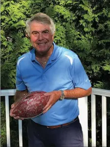  ?? MEDIANEWS GROUP PHOTO ?? Merrill Reese sports his new ‘natural’ haircut in an exclusive photo while gripping an autographe­d Super Bowl LII football. The legendary Eagles’ play-by-play announcer cannot wait to begin his 44th season calling games.