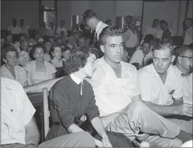  ?? (File Photo/AP) ?? Carolyn Bryant rests her head on her husband Roy Bryant’s shoulder Sept. 22. 1955, after she testified in the Emmett Till murder trial in Sumner, Miss.