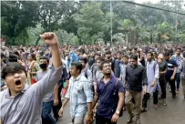  ?? Reuters ?? Students shout slogan during a rally as they join a protest in Dhaka over recent traffic accidents that killed two students. —