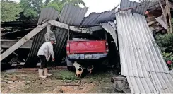  ?? | Reuters ?? A DAMAGED car and house after an earthquake in La Nuez, Michoacan, Mexico.