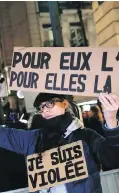  ??  ?? An activist holds a banner that says: “For him impunity, for her a life sentence” at a protest in Paris.