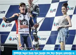  ??  ?? BURIRAM: Repsol Honda Team Spanish rider Marc Marquez celebrates on the podium after winning the MotoGP race for the Thailand Grand Prix at Buriram Internatio­nal Circuit in Buriram. —AFP