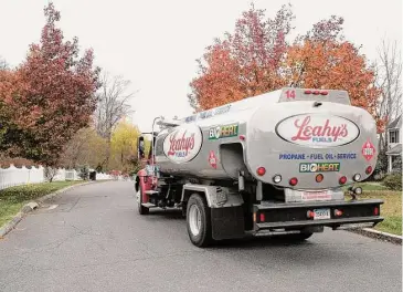  ?? H John Voorhees III / Hearst Connecticu­t Media file photo ?? Leahy’s Fuels oil delivery makes a home heating oil delivery to a Danbury home.