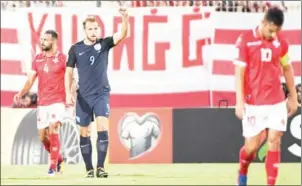  ?? ANDREAS SOLARO/AFP ?? England striker Harry Kane celebrates after scoring in the 2018 FIFA World Cup qualifier against Malta at the National Stadium in Ta’Qali, Malta, on Friday.