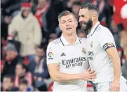  ?? REUTERS ?? Real Madrid’s Toni Kroos, left, celebrates with Karim Benzema after scoring against Athletic Bilbao.