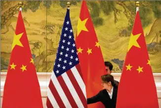  ?? ASSOCIATED PRESS 2019 ?? The future of U.s.-chinese relations is facing another twist with the widening policy divergence putting strains on exchange rates and potentiall­y reshaping global capital flows.