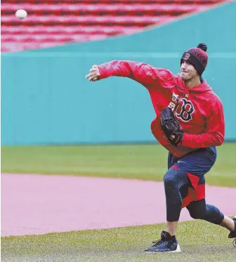  ?? STAFF PHOTO BY MATT STONE ?? THROWIN' IN THE RAIN: Yesterday's game against the Pirates was washed out, but Rick Porcello still managed to get some work in amidst the raindrops.