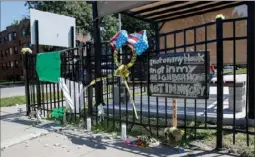  ?? Kamil Krzaczynsk­i/ AFP/ Getty Images ?? A memorial where two mothers volunteeri­ng with a group called Mothers Against Senseless Killing were shot and killed July 26 in the South Side of Chicago. Early Sunday, within an hour of the Dayton, Ohio, shooting, someone opened fire in Chicago’s Douglas Park, sending seven people to the hospital with gunshot wounds.