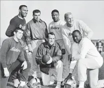  ?? Robert Klein
Associated Press ?? A 10-YEAR PRO FOOTBALL CAREER Receiver Art Powell is at right in this photograph of six Oakland Raiders who were named to the Associated Press’ 1963
AFL All-Star team. At center is Coach Al Davis.