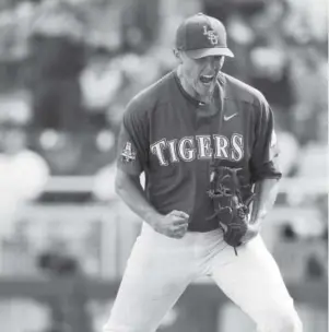  ??  ?? LSU’s Zack Hess celebrates after the final out against Oregon State during a College World Series eliminatio­n game Saturday in Omaha. Brendan Sullivan, Omaha World-Herald