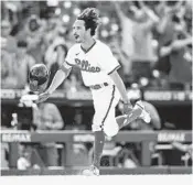  ?? CHRIS SZAGOLA AP ?? Torrey Pines High grad Garrett Stubbs races home after his three-run walkoff homer for Phillies.