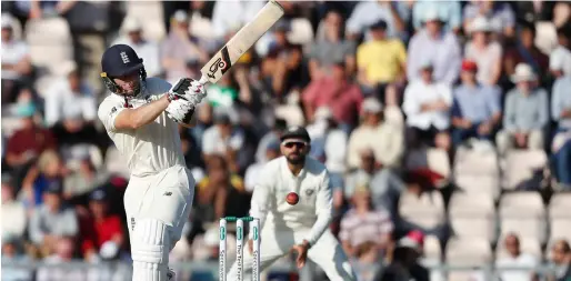  ??  ?? Jos Buttler plays a shot during the third day of the fourth Test at the Ageas Bowl in Southampto­n. — AP